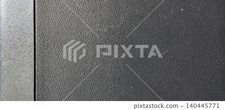Black textured plastic surface with fine embossed pattern. Black textured plastic surface with fine embossed pattern. 140445771