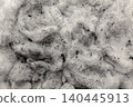 Black charcoal dust scattered on white cotton textured surface, pollution and environmental issue 140445913