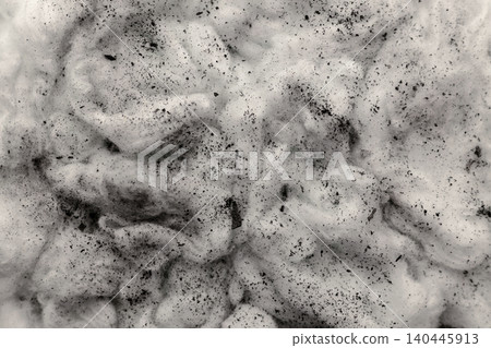 Black charcoal dust scattered on white cotton textured surface, pollution and environmental issue Black charcoal dust scattered on white cotton textured surface, pollution and environmental issue 140445913