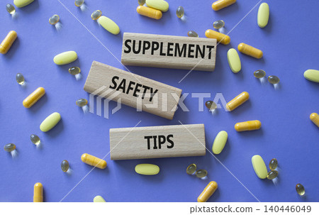 SUPPLEMENT SAFETY TIPS symbol. Concept words SUPPLEMENT SAFETY TIPS on wooden blocks. Beautiful purple background with pills. Healthcare and SUPPLEMENT SAFETY TIPS concept. Copy space. SUPPLEMENT SAFETY TIPS symbol. Concept words SUPPLEMENT SAFETY TIPS on wooden blocks. Beautiful purple background with pills. Healthcare and SUPPLEMENT SAFETY TIPS concept. Copy space. 140446049