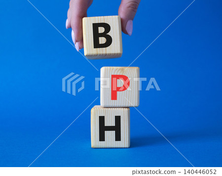 BPH - Benign Prostatic Hyperplasia symbol. Wooden cubes with word BPH. Businessman hand. Beautiful blue background. Medical and BPH concept. Copy space. BPH - Benign Prostatic Hyperplasia symbol. Wooden cubes with word BPH. Businessman hand. Beautiful blue background. Medical and BPH concept. Copy space. 140446052