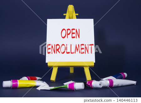 Open Enrollment symbol. Wooden blocks with words Open Enrollment. Beautiful grey background with paints and easel. Business and Open Enrollment concept. Copy space. Open Enrollment symbol. Wooden blocks with words Open Enrollment. Beautiful grey background with paints and easel. Business and Open Enrollment concept. Copy space. 140446113