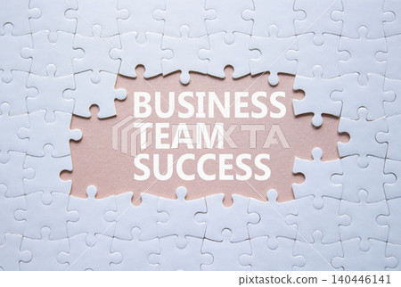 Business Team Success symbol. White puzzle with words Business Team Success. Beautiful pink background. Business concept. Copy space. Business Team Success symbol. White puzzle with words Business Team Success. Beautiful pink background. Business concept. Copy space. 140446141