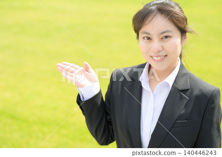 A Japanese female office worker in her 20s who was giving the tour. A Japanese female office worker in her 20s who was giving the tour. 140446243