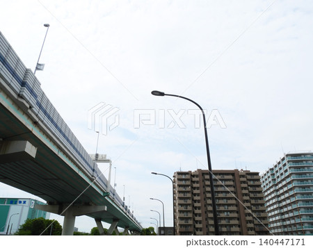 Urban landscape with apartment buildings and highways | Tatsumi Urban landscape with apartment buildings and highways | Tatsumi 140447171