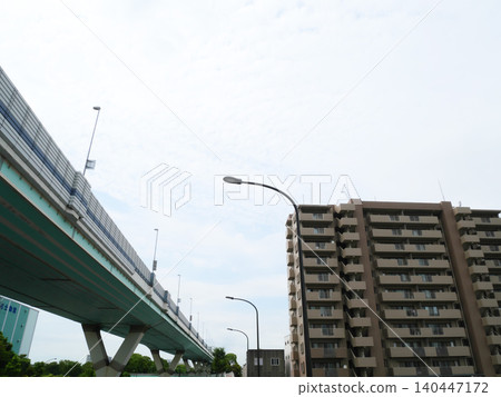 Urban landscape with apartment buildings and highways | Tatsumi Urban landscape with apartment buildings and highways | Tatsumi 140447172