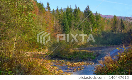 September.Country dirt road leading to the mountain September.Country dirt road leading to the mountain 140447613