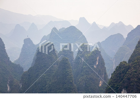 famous karst mountains in Yangshuo District, Guangxi Province, China famous karst mountains in Yangshuo District, Guangxi Province, China 140447706