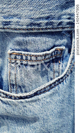 Close-up of a pocket on blue denim jeans Close-up of a pocket on blue denim jeans 140447906