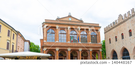 Historical Amintore Galli Theatre building facade in Rimini city square. Italy brick neoclassic at Piazza Cavour Historical Amintore Galli Theatre building facade in Rimini city square. Italy brick neoclassic at Piazza Cavour 140448167