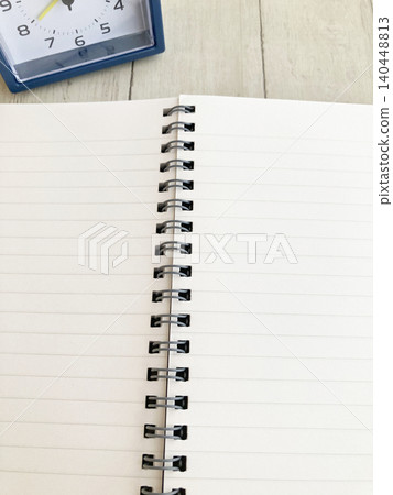 Time management, daily routines, studying, schedule book, diary, task management, ring notebook and blue alarm clock Time management, daily routines, studying, schedule book, diary, task management, ring notebook and blue alarm clock 140448813