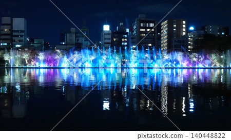 A beautifully lit fountain show along the river. 140448822