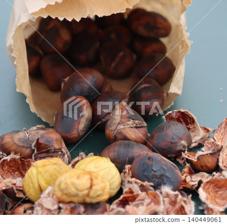 bag of roasted chestnuts to peel- bag of roasted chestnuts to peel- 140449061