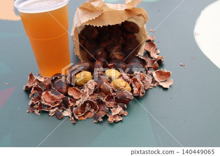 bag of roasted chestnuts with beer- bag of roasted chestnuts with beer- 140449065