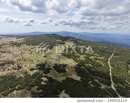 High mountain ridge with hiking trail under cloudy sky High mountain ridge with hiking trail under cloudy sky 140450114