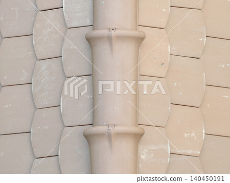 Close-up of beige ceramic roof tiles with central ridge Close-up of beige ceramic roof tiles with central ridge 140450191