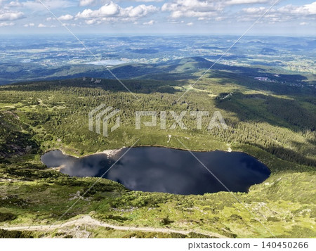 Mountain tarn and surrounding alpine landscape from high viewpoint Mountain tarn and surrounding alpine landscape from high viewpoint 140450266