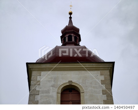 Historic church tower against a cloudy sky 140450497