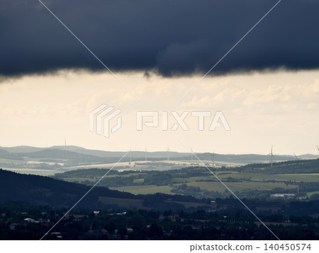 Storm clouds over rolling countryside Storm clouds over rolling countryside 140450574