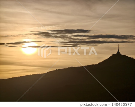 Golden sunset over mountain silhouette 140450577