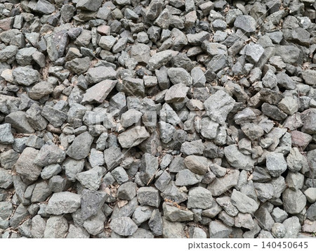 Loose crushed gray gravel piled outdoors Loose crushed gray gravel piled outdoors 140450645
