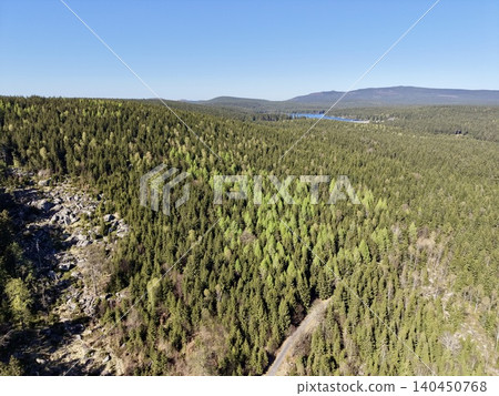 Rugged Ridge With Distant Lake. Vivid Depiction Of Wild Outdoor Scenery And Geological Formations 140450768