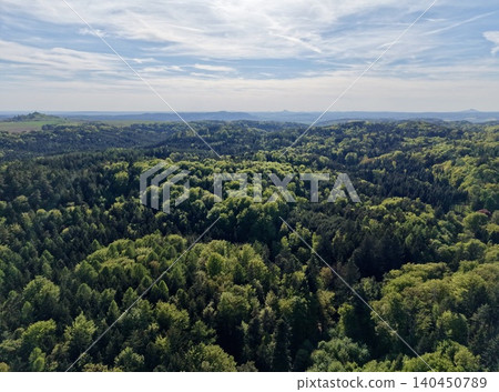 Forests Meeting Distant Rolling Hills. Vast Sky Over Layered Green Woodland With Rolling Hills Forests Meeting Distant Rolling Hills. Vast Sky Over Layered Green Woodland With Rolling Hills 140450789
