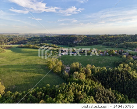 Vivid Aerial Farm View. Dusk Reveals Detailed Farm Landscape From Above With Trees And Fields Vivid Aerial Farm View. Dusk Reveals Detailed Farm Landscape From Above With Trees And Fields 140450796