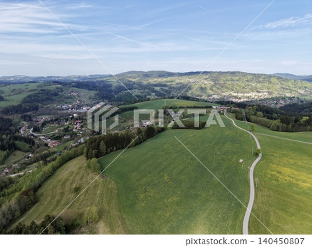 Scenic Countryside Panorama. Picturesque Landscape Showcasing Rolling Hills And Peaceful Village Scene Scenic Countryside Panorama. Picturesque Landscape Showcasing Rolling Hills And Peaceful Village Scene 140450807
