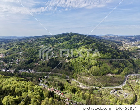 Landscape Of Wooded Hills And Roads. Vast View Of Wooded Hills With Winding Roads And Morning Mist Landscape Of Wooded Hills And Roads. Vast View Of Wooded Hills With Winding Roads And Morning Mist 140450814