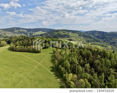Tranquil Hillside Landscape Showcasing Twisting Pathways Surrounded By Trees And Expansive Meadows 140450826