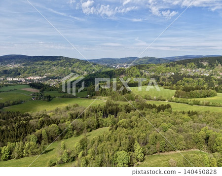 Pastoral Rural Scenery. Serene Pastoral Landscape Featuring Vibrant Farmlands And Dense Wooded Areas Pastoral Rural Scenery. Serene Pastoral Landscape Featuring Vibrant Farmlands And Dense Wooded Areas 140450828