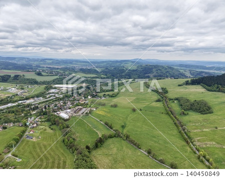 Farmland And Community Aerial View. Small Settlement Surrounded By Fields And Roads Seen From Above Farmland And Community Aerial View. Small Settlement Surrounded By Fields And Roads Seen From Above 140450849