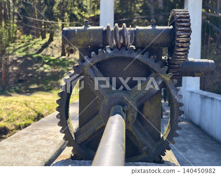 Ancient Industrial Hydraulic Components With Natural Surroundings Indicating Maintenance Activity Ancient Industrial Hydraulic Components With Natural Surroundings Indicating Maintenance Activity 140450982