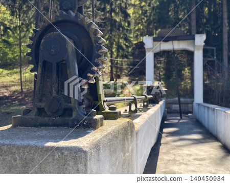 Close Examination Of Weathered Industrial Machinery Set Against Heritage And River Environment 140450984