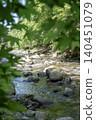 The Fuefuki River stream and fresh greenery in early summer (Yamanashi City, Yamanashi Prefecture) 140451079