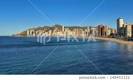 A Serene Coastal Landscape Featuring Beautiful, Crystal Clear Waters Beneath a Blue Sky A Serene Coastal Landscape Featuring Beautiful, Crystal Clear Waters Beneath a Blue Sky 140451122