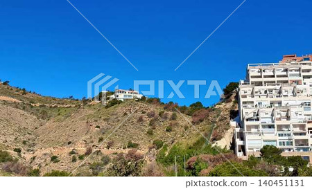 The Stunning Hillside Homes Are Beautifully Set Against a Brilliant Blue Sky Above Them The Stunning Hillside Homes Are Beautifully Set Against a Brilliant Blue Sky Above Them 140451131