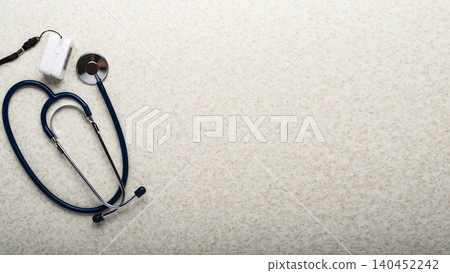 Healthcare medical background of stethoscope and pulse oximeter flat lay on table with copy-space Healthcare medical background of stethoscope and pulse oximeter flat lay on table with copy-space 140452242