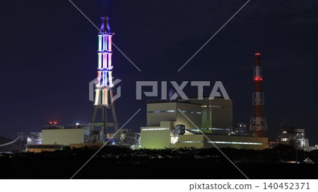 The factory night view of the Joban Joint Thermal Power Nakoso Power Plant and the chimneys illuminated in various colors as part of the "Nakoso Yume Light" illumination event. The factory night view of the Joban Joint Thermal Power Nakoso Power Plant and the chimneys illuminated in various colors as part of the "Nakoso Yume Light" illumination event. 140452371