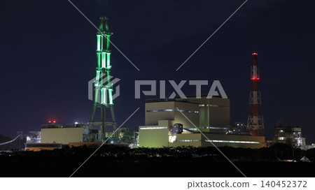 The night view of the Joban Joint Thermal Power Nakoso Power Plant, and its chimneys illuminated in green by the "Nakoso Yume Light" illumination project. The night view of the Joban Joint Thermal Power Nakoso Power Plant, and its chimneys illuminated in green by the "Nakoso Yume Light" illumination project. 140452372