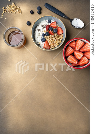 Healthy breakfast ingredients yogurt granola berries Healthy breakfast ingredients yogurt granola berries 140452419