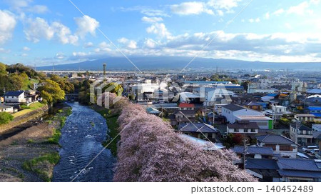 Mount Fuji and the cherry blossom trees in full bloom at Ryuganbuchi | A classic aerial view 140452489