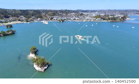 A panoramic view of Matsushima, one of Japan's three most scenic spots, with sightseeing boats coming and going. A panoramic view of Matsushima, one of Japan's three most scenic spots, with sightseeing boats coming and going. 140452500