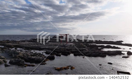A stunning aerial view of the red torii gate standing in the sea off Hayama Beach in Kanagawa Prefecture. A stunning aerial view of the red torii gate standing in the sea off Hayama Beach in Kanagawa Prefecture. 140452532