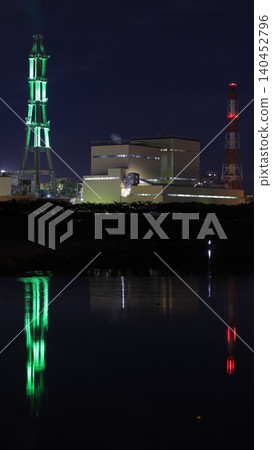 The night view of the Joban Joint Thermal Power Nakoso Power Plant, and its chimneys illuminated in green by the "Nakoso Yume Light" illumination project. The night view of the Joban Joint Thermal Power Nakoso Power Plant, and its chimneys illuminated in green by the "Nakoso Yume Light" illumination project. 140452796