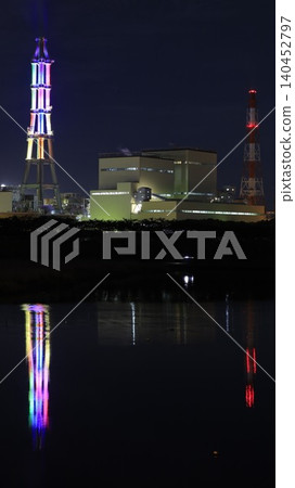 The factory night view of the Joban Joint Thermal Power Nakoso Power Plant and the chimneys illuminated in various colors as part of the "Nakoso Yume Light" illumination event. The factory night view of the Joban Joint Thermal Power Nakoso Power Plant and the chimneys illuminated in various colors as part of the "Nakoso Yume Light" illumination event. 140452797