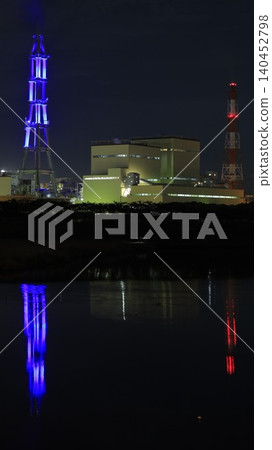 The night view of the Joban Joint Thermal Power Nakoso Power Plant, and its chimneys illuminated in blue by the "Nakoso Yume Light" illumination project. 140452798