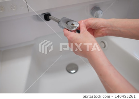 Removed shower head on the sink 140453261
