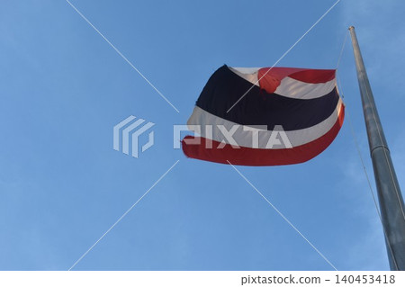 tree colors national Thailand flag lower to half-mast on pole for remembrance important person in sky background tree colors national Thailand flag lower to half-mast on pole for remembrance important person in sky background 140453418